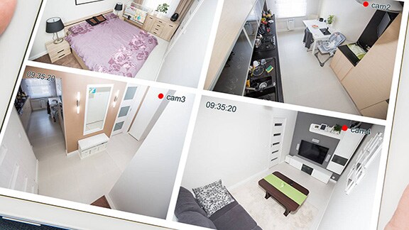 Close-up of a person holding the tab and scanning the cctv footages