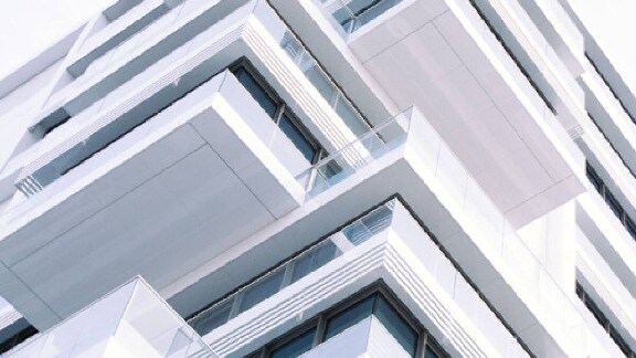 A bottom view of a white building