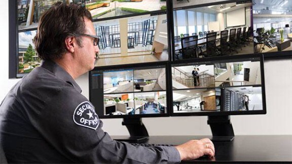 Security personnel monitoring the CCTV footages on the monitor in the control room