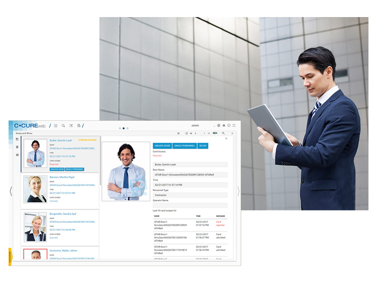 C- Cure access management interface on monitor in the inset view of the employee accessing his tab