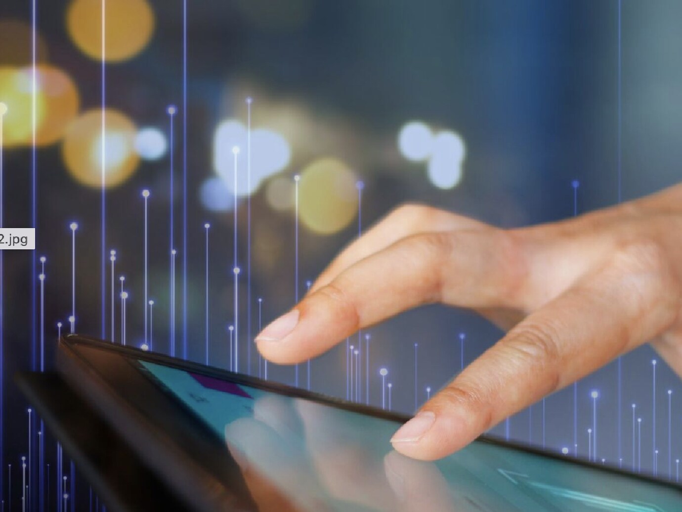 Close-up of a person scrolling on a tablet, overlaid with OpenBlue graphics