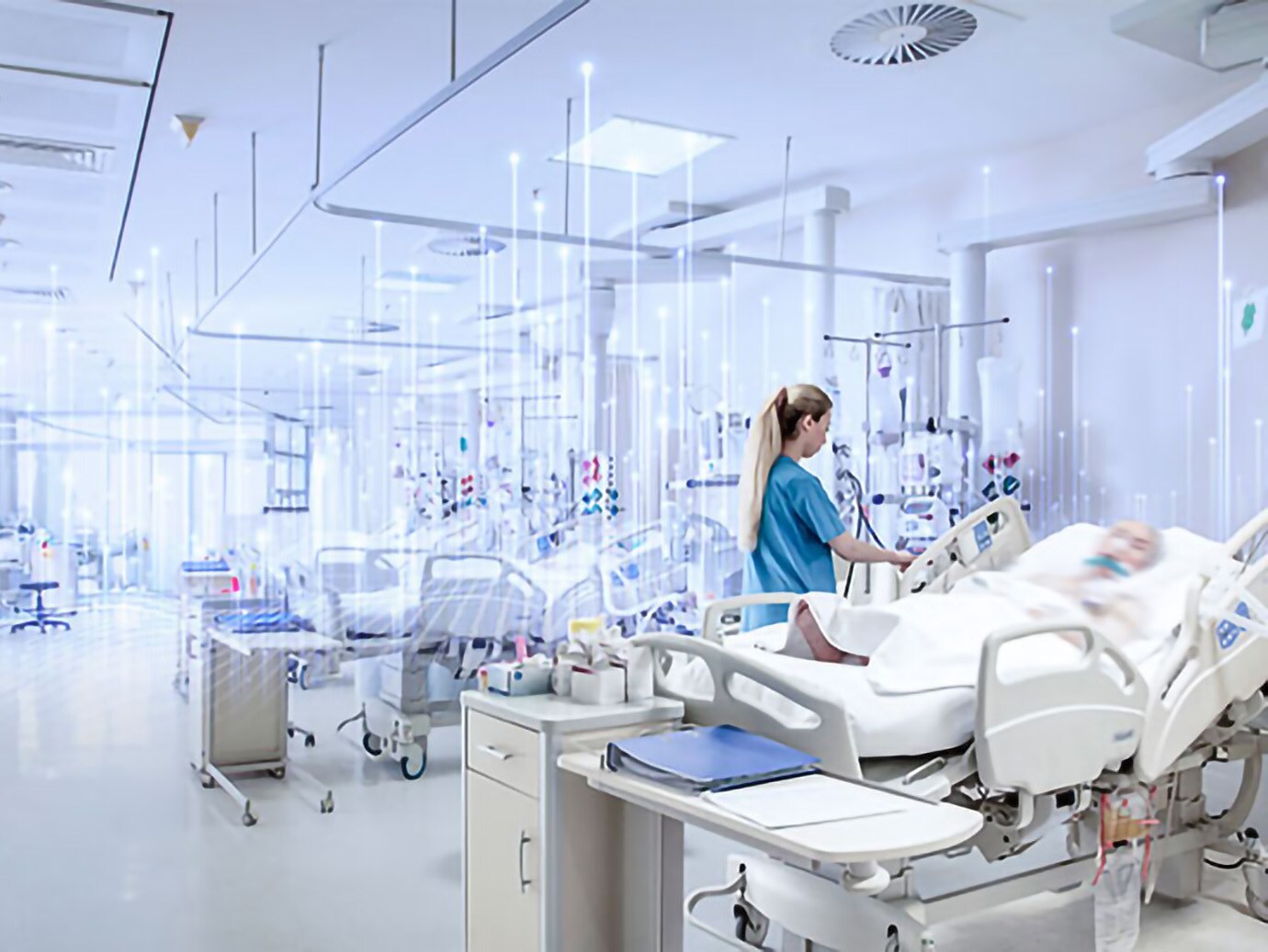 A female nurse assisting an elderly patient in an emergency ward