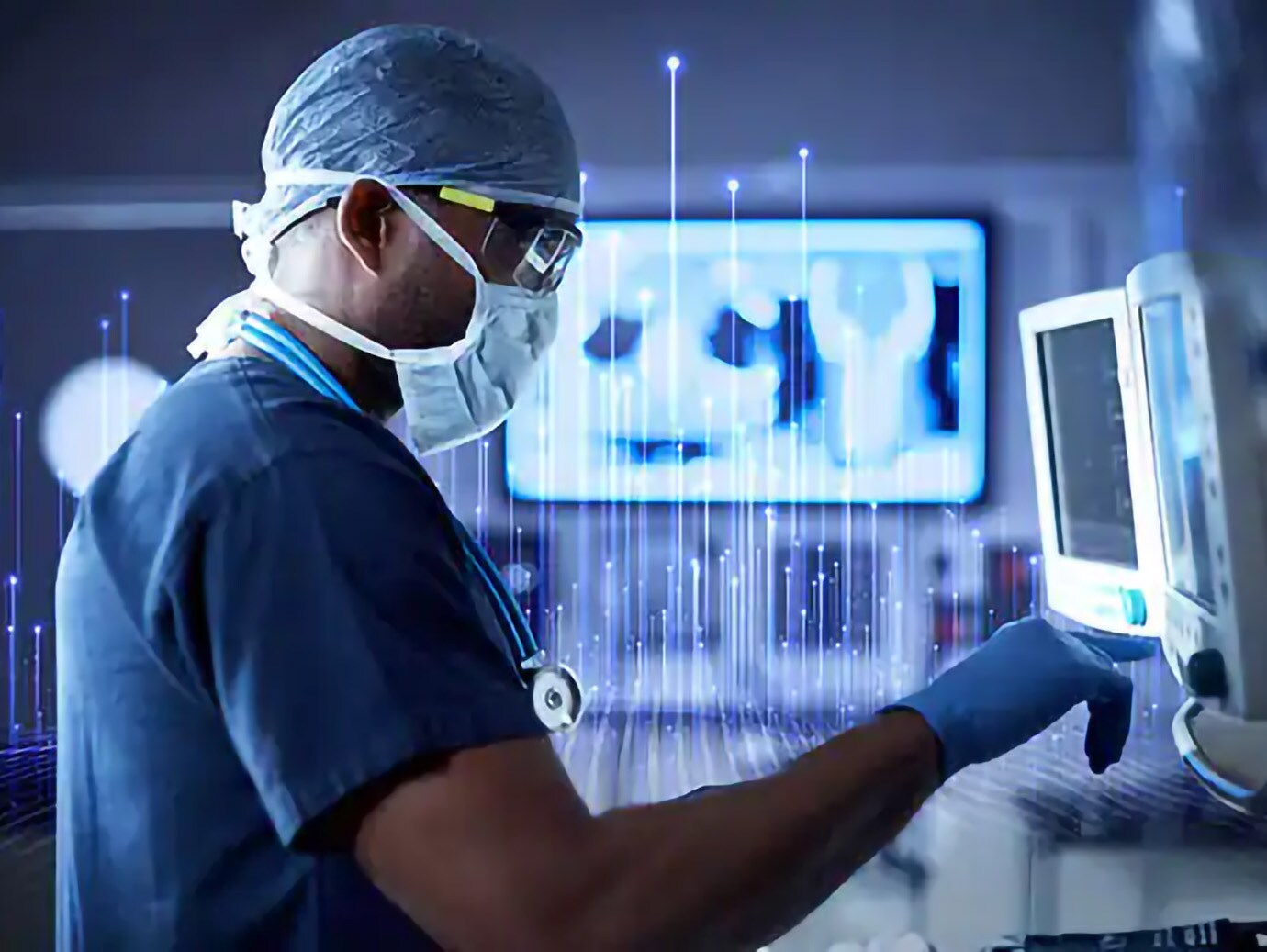 A surgeon in scrubs operating a healthcare device
