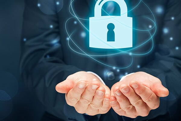 A person holding a data security technology icon in his hands