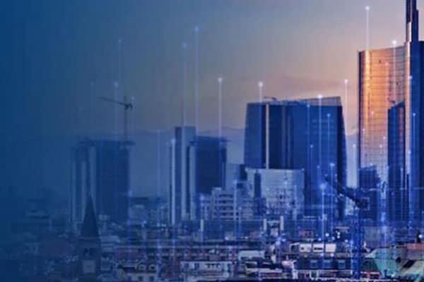 Aerial view of the city with skyscrapers overlaid with graphics of transmission nodes